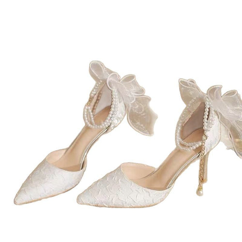 Sandals with stiletto heel, tapered toe and strap on the heel